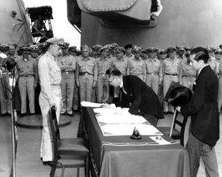 Japanese Foreign Minister Mamoru Shigemitsu signs the Instrument of Surrender on behalf of the Japanese Government, formally ending World War II (US Army)
